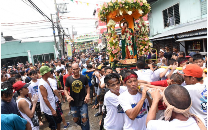 <p><strong>WATER FESTIVAL</strong>. Cavite City’s “Regada Water Festival 2018” revelers and devotees join the annual festivity of getting drenched with water to mark the Feast of St. John the Baptist along the city’s major thoroughfares and activity areas. <em>(Photo by Dennis Abrina)</em></p>